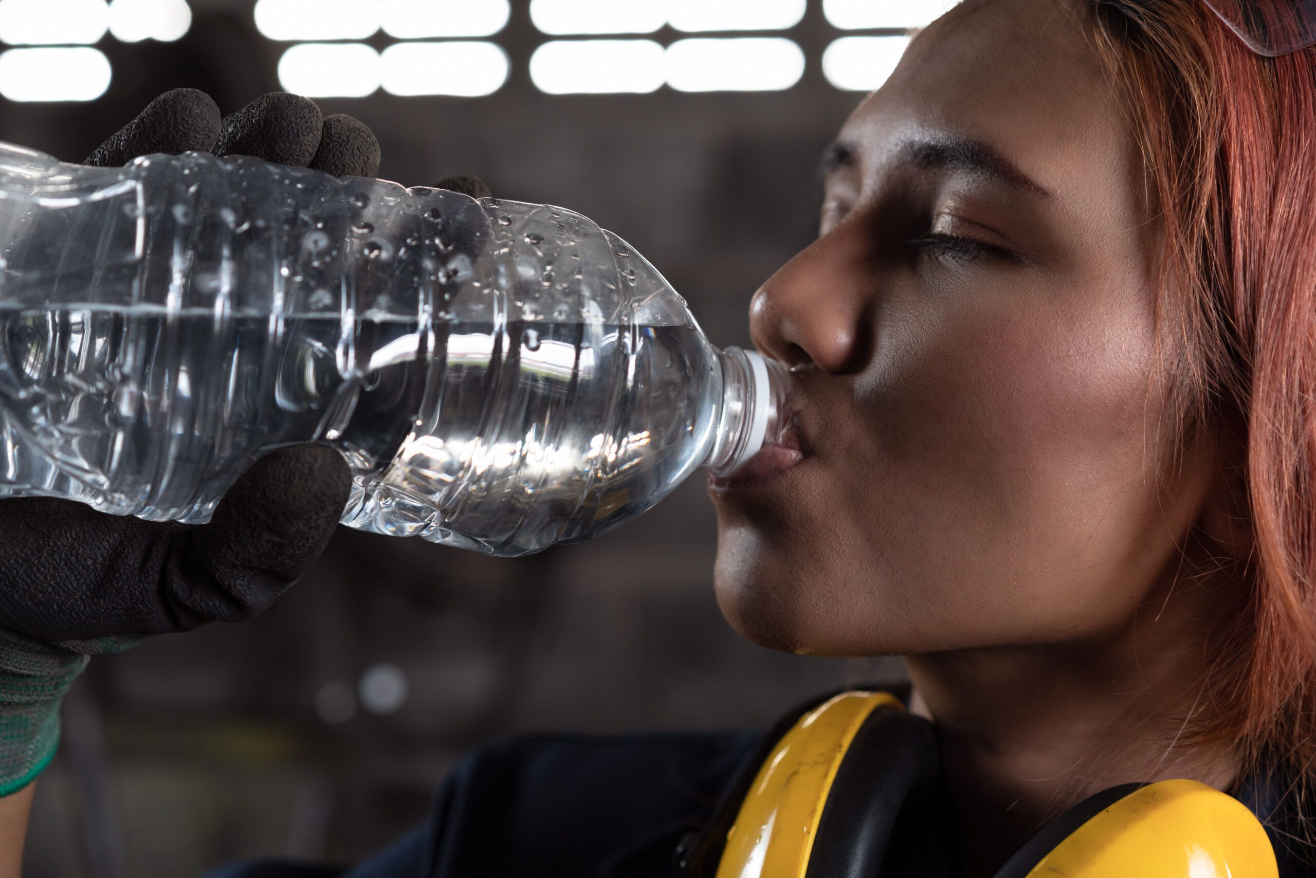 Female,Industrial,Engineer,Drinking,Water,From,Bottle,During,Work,Break watch for falling objects sign