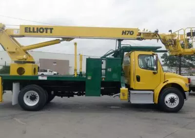 custom yellow h 70 truck shown from side