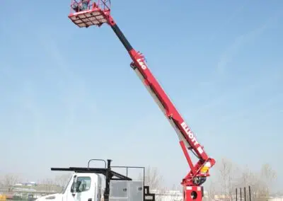 L 60 truck with arm extended and worker on platform